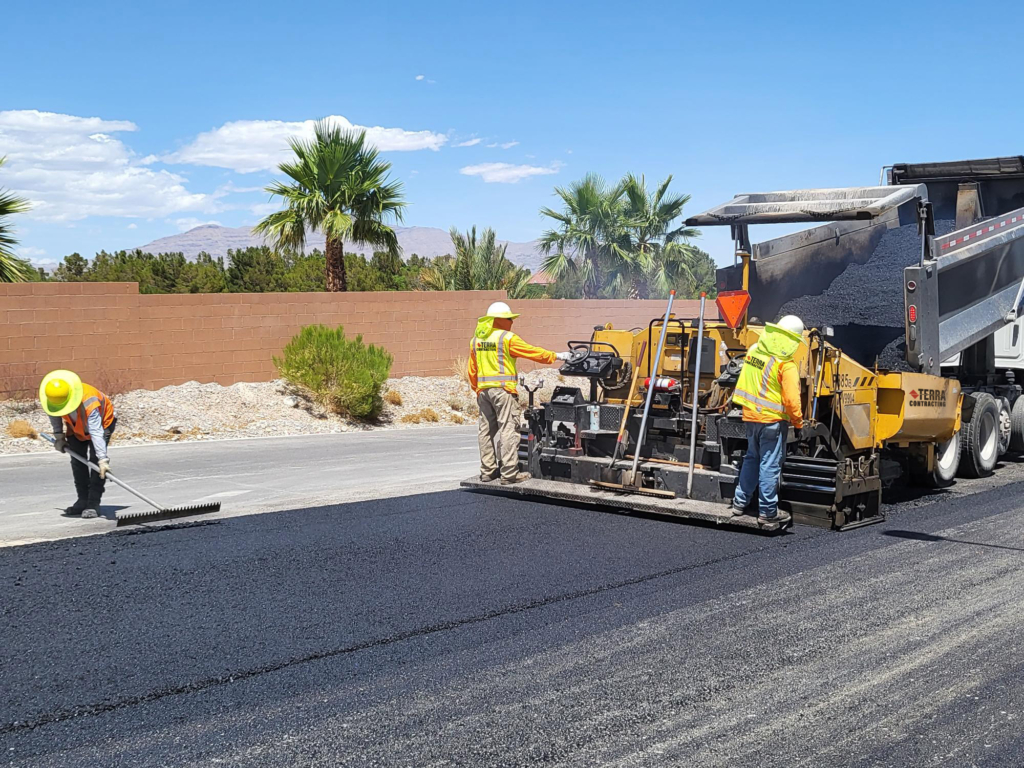 Asphalt paving crew laying asphalt