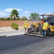 Asphalt paving crew laying asphalt