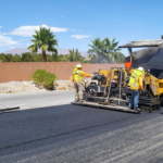 Workers paving a roadway