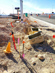 Utility relocation and conduit installation work during the Tropicana and I-15 bridge improvements project in Las Vegas, Nevada