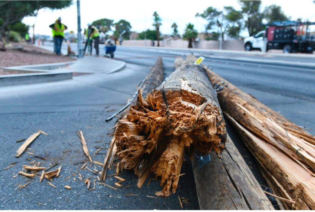 Emergency Utility Pole and Infrastructure Restoration Broken utility pole after roadway incident requiring emergency fiber and power restoration services